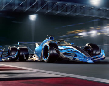 Two F1 Racing Cars Moving At High Speed During Night Race